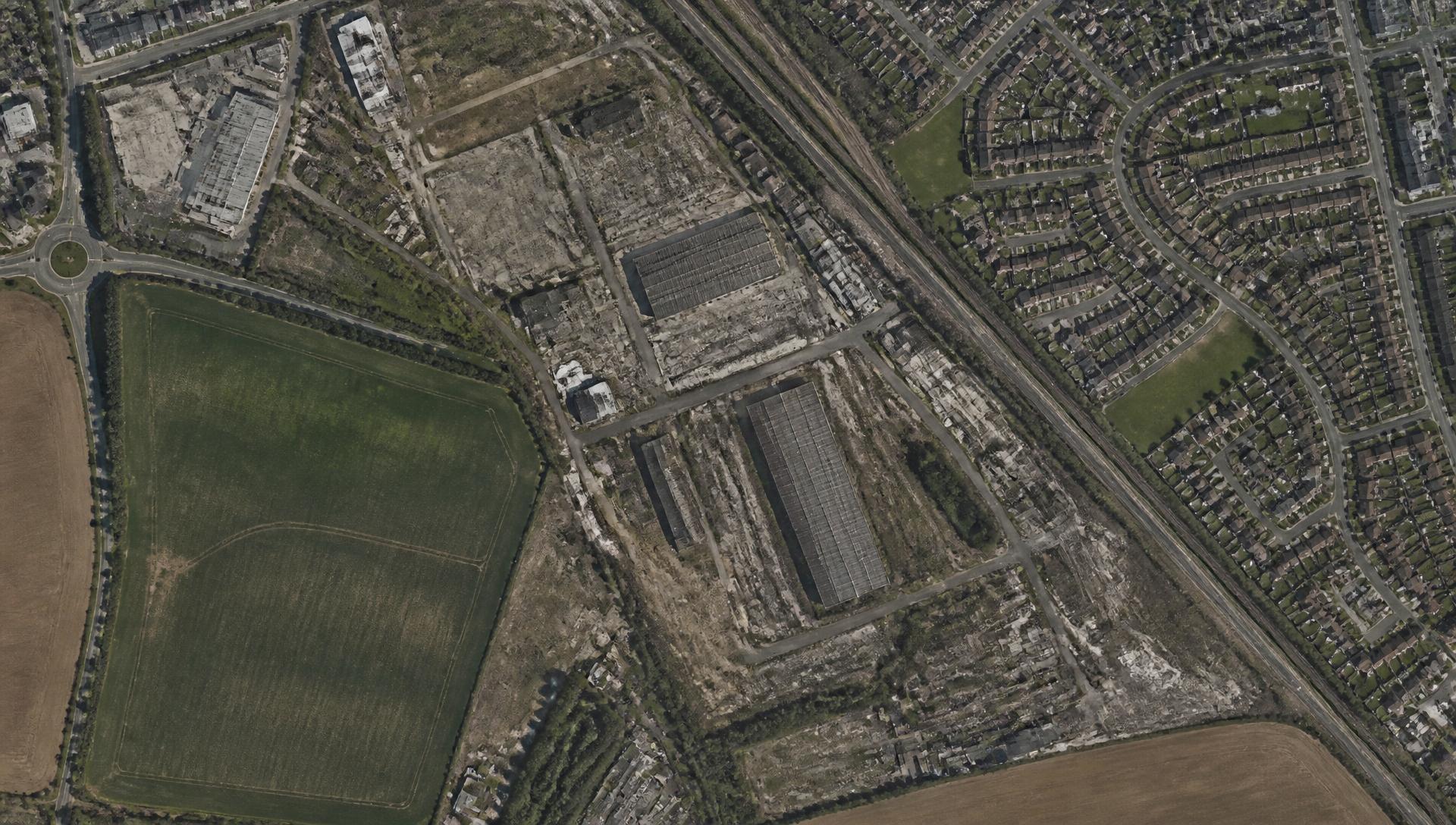 Top-down satellite view of a brownfield and industrial edge site